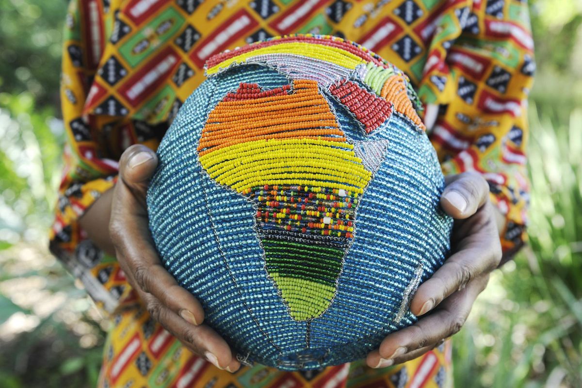 African holding globe